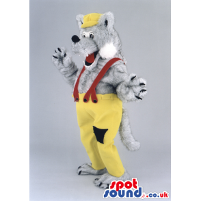 Fluffy grey wolf wearing yellowcap and trousers with black