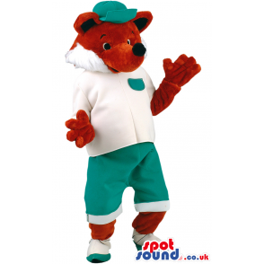 Pleased fox mascot with green cap, white T-shirt and shoes -