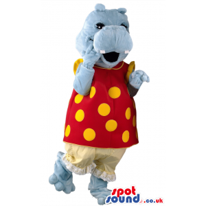 Delighted looking hippo mascot in red dress and yellow polka