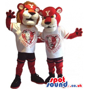 Two Red And White Lion Plush Mascots In T-Shirts With A Team