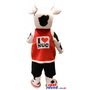 Black And White Cow Plush Mascot Wearing A Red Shirt With