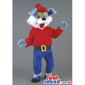 Upbeat dog mascot with red cap, T-shirt and blue trousers -