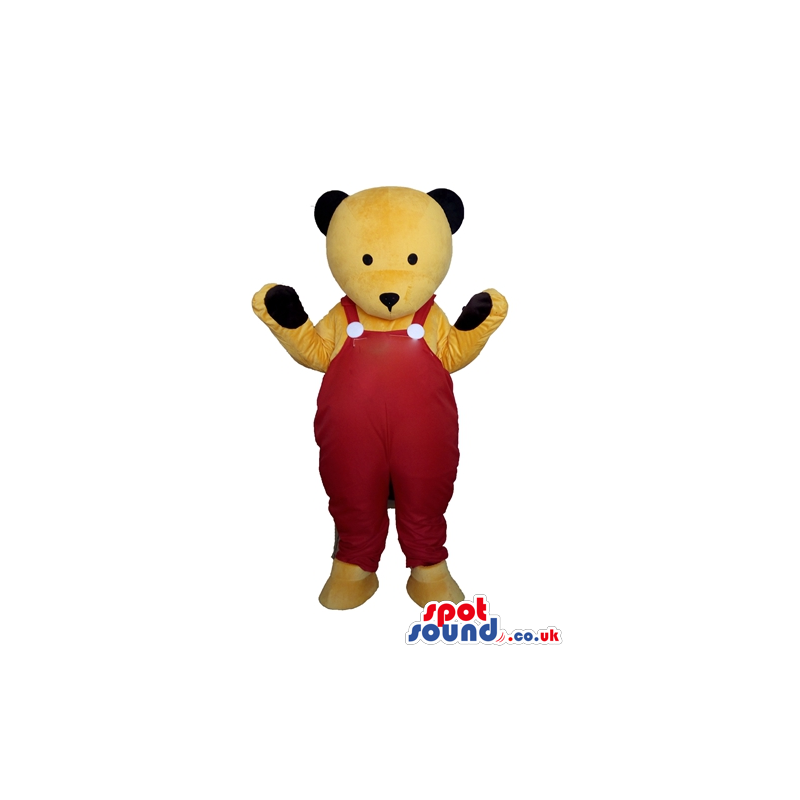 Bear mascot looking to the front with red gardener trousers -