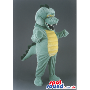 Overjoyed green dragon mascot with spines and yellow underbelly