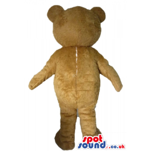 Brown teddy bear with white mouth, round ears and black eyes -