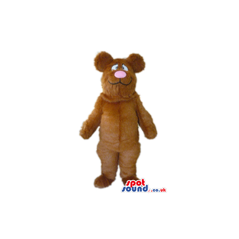 Brown teddy bear with big black and white eyes and a big pink Brown teddy bear with big black and white eyes and a big pink
