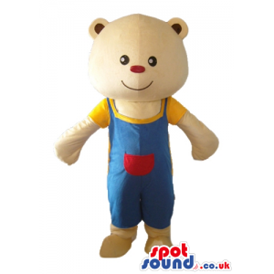 Smiling light-brown teddy bear with small red nose with blue