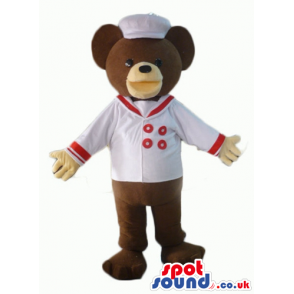 Chocolate brown teddy bear with beige hands in white sailor