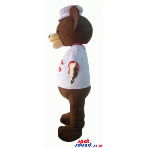 Chocolate brown teddy bear with beige hands in white sailor
