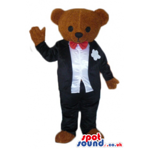 Chocolate brown teddy bear dressed like a groom with red bow