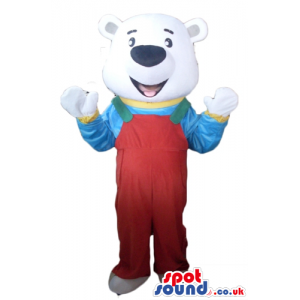 Smiling white bear dressed in red and green gardener trousers