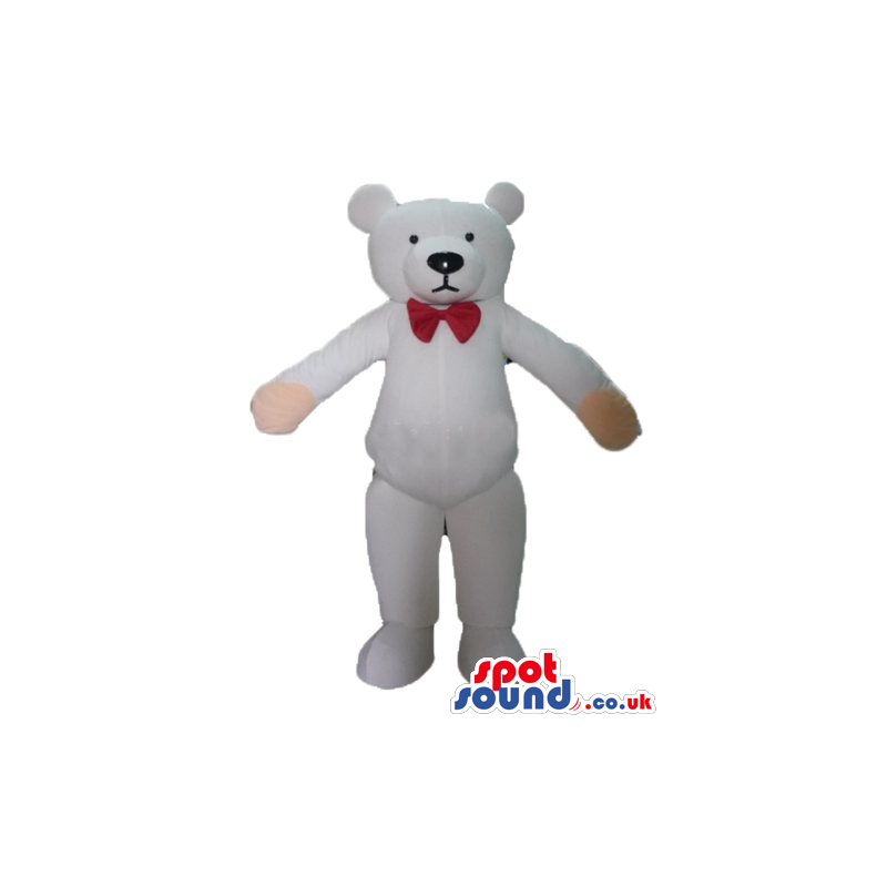 Serious white teddy bear with pink hands wearing a small red