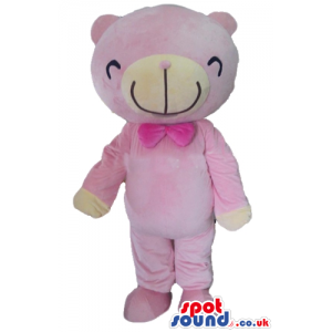 Smiling pink bear with matching pink bow tie and white detail