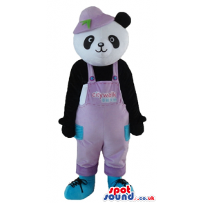 Panda bear dressed in pink gardener trousers, a pink hat and