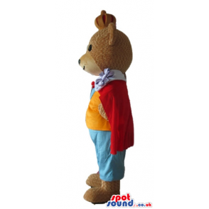 Brown bear dressed like a king with light blue trousers, orange