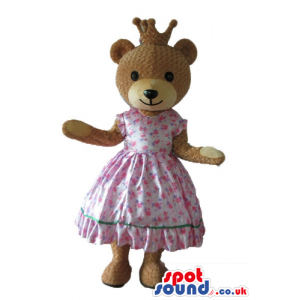 Femenine brown bear dressed as a princess in a pink flowery