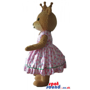 Femenine brown bear dressed as a princess in a pink flowery