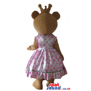 Femenine brown bear dressed as a princess in a pink flowery