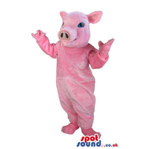 Pink pig mascot with blue eyes, big ears and smiling face -