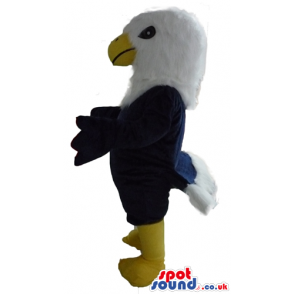 Black eagle mascot with a white head, a yellow beak and yellow