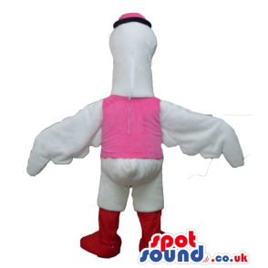 White duck with red legs wearing a pink vest, a pink bow tie