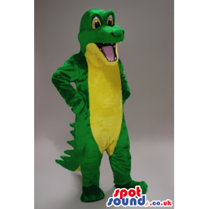 Green crocodile mascot with big yellow eyes and white teeth