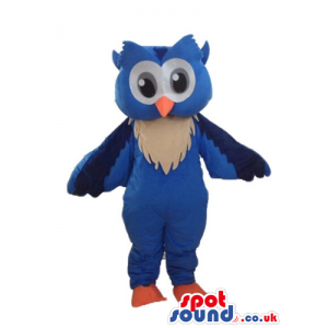 Blue owl with beige detail on chest, big grey eyes and orange