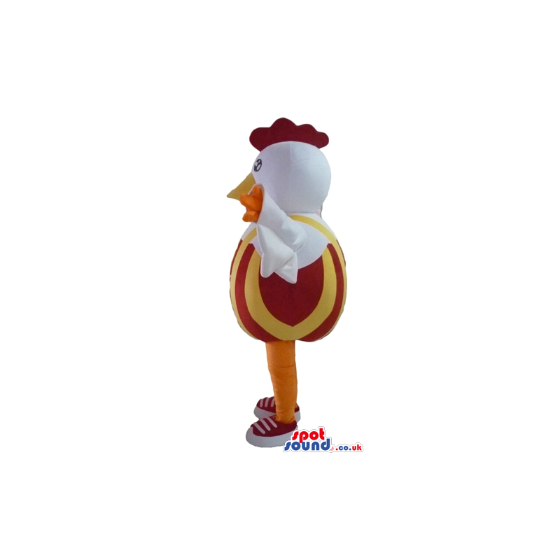 white cock with red hair and yellow leg with a red and orange