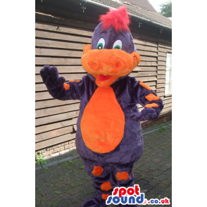 Friendly purple dragon mascot with red hair and orange snout. -