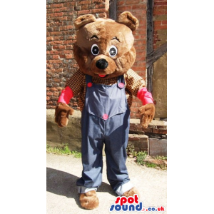 Teddy bear mascot wearing farmers shirt and jean overalls -