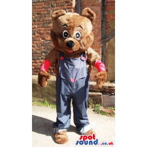 Teddy bear mascot wearing farmers shirt and jean overalls -