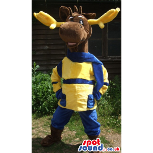 Standing deer mascot with yellow antlers and blue trousers