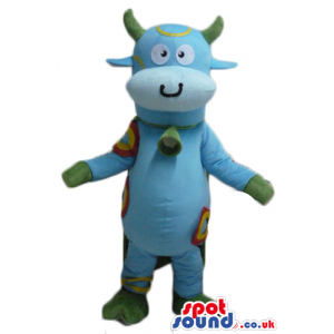 Light-blue lovely cow with green horns, hands and feet with