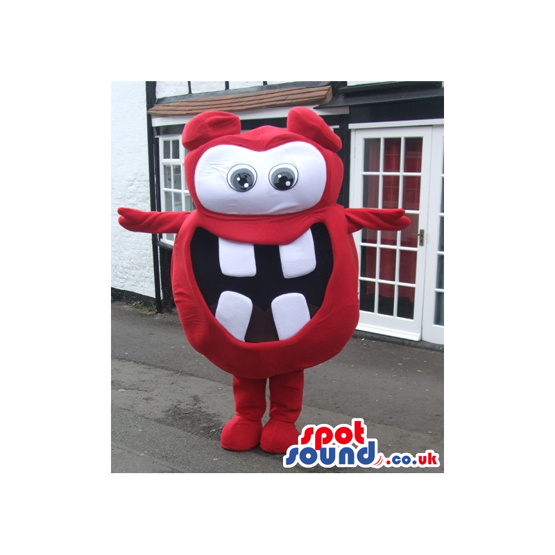 Red monster mascot with big round eyes and white squared teeth