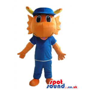 Orange monster dressed in a blue t-shirt, blue trousers and a