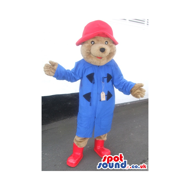 Bear mascot wearing red hat and long blue coat and red boots -