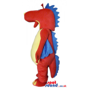 Red dino with a yellow belly and blue wings and plaques on head