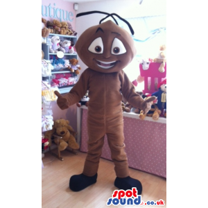 Giant standing brown ant mascot with thick black antennae