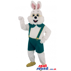 Fluffy white rabbit mascot with green trousers and strap -