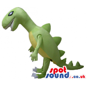 Lime green dino with yellow belly, sharp teeth and white toes -
