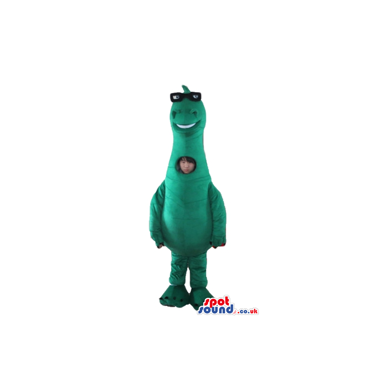 Green dino with black glasses and a picture on the chest -