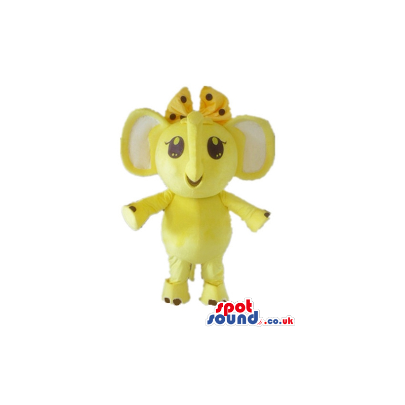 Yellow elephant with white ears and a yellow and black ribbon -