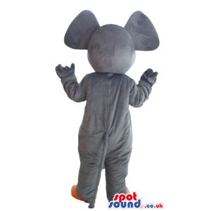 Grey elephant with orange ears and feet and picture on the