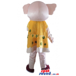 Pink elephant in a yellow and green dress with brown shoes -