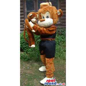 Brown and black monkey mascot with brown hat and little monkey