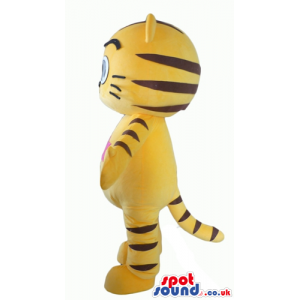 Yellow tiger with big black eyes and a pink star on the chest -