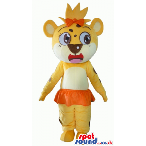 Yellow lioness with big eyes, an orange bow on the head and an